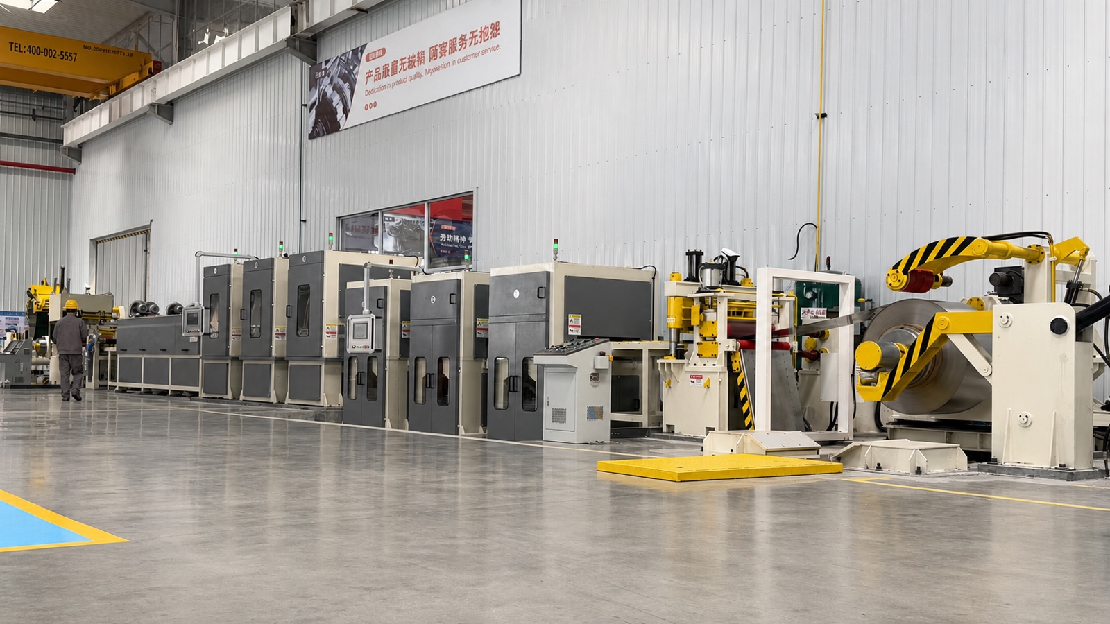 Side view of polishing stations and coil recoiling section
