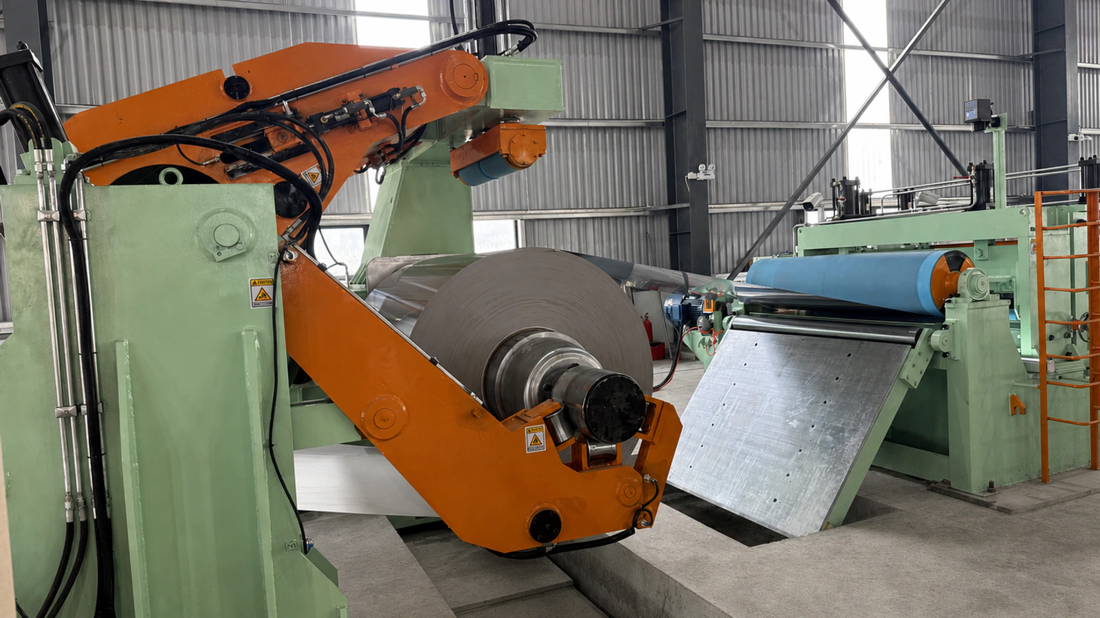 Coil handling, pressure arm, and pinch-roll section