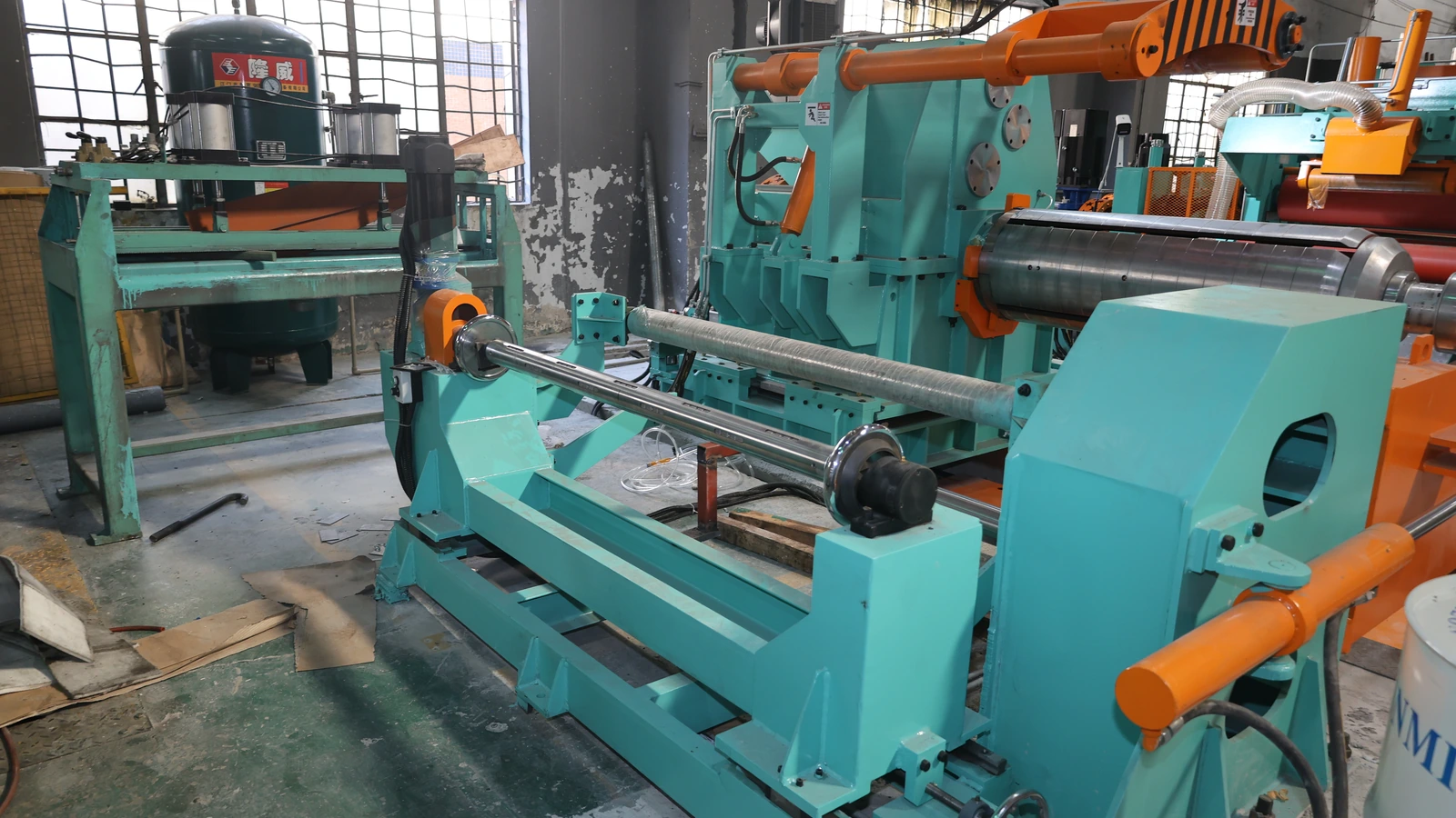 Coil rewinding and strip guiding equipment on the stainless steel coil-to-coil polishing line