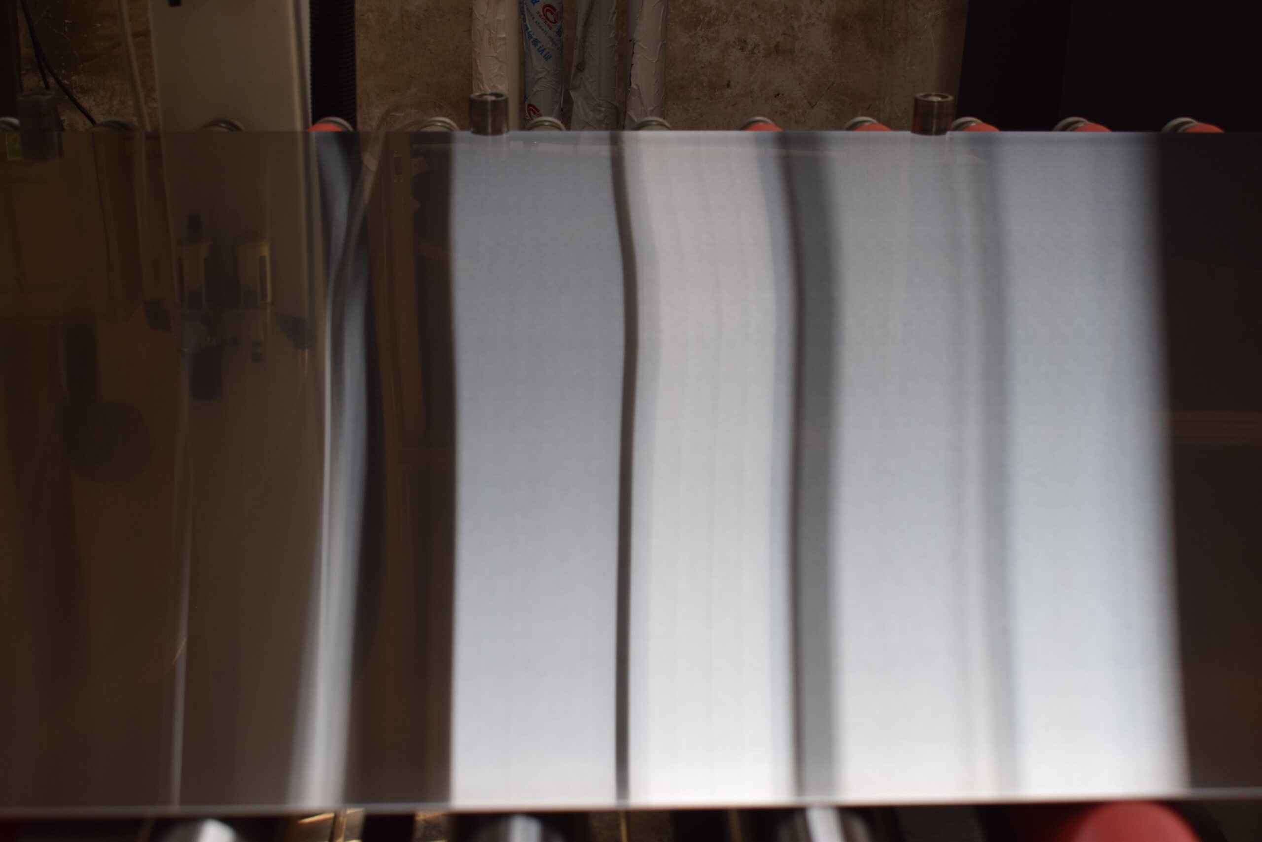 Stainless steel sheet with No.4 snowflake finish during production inspection
