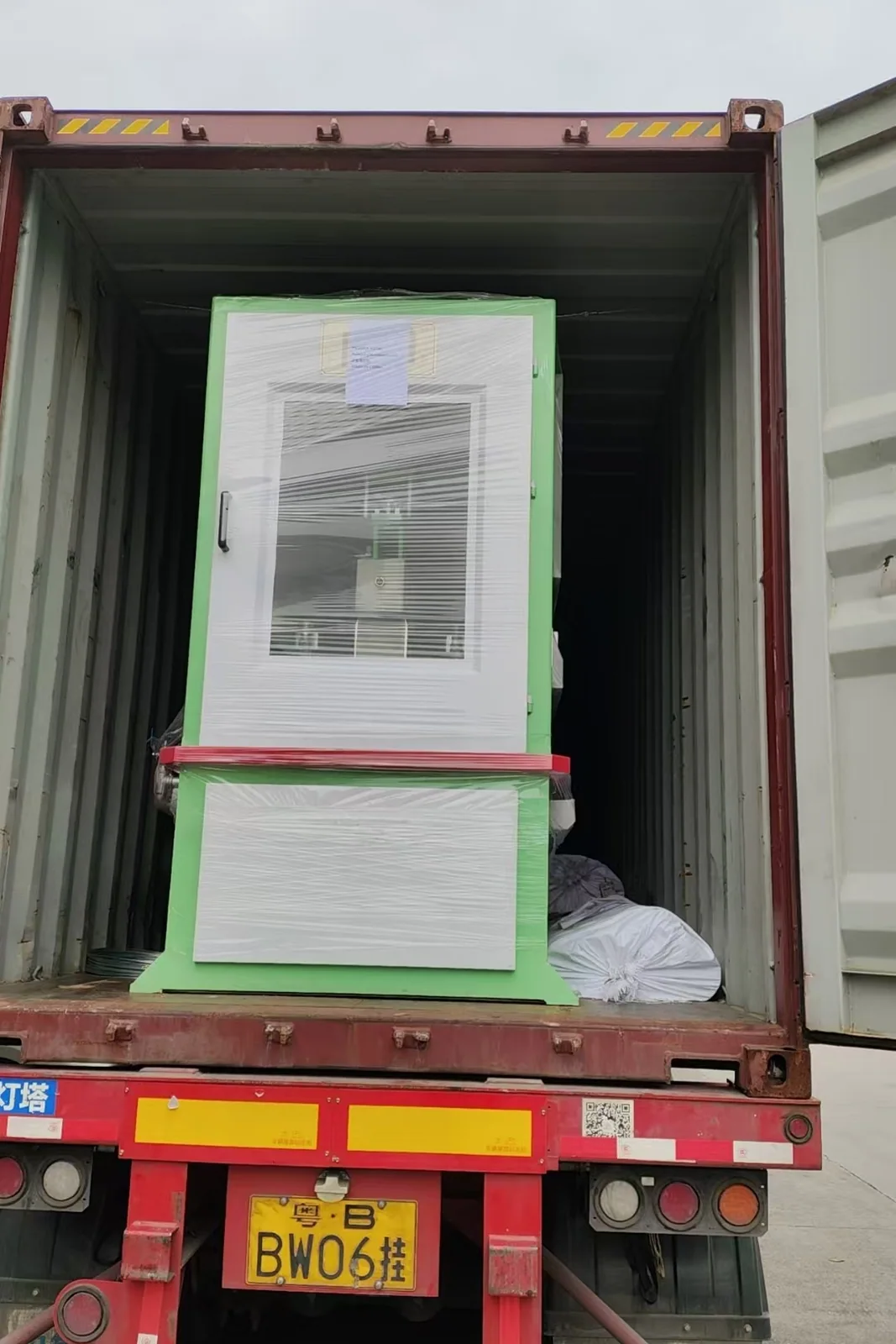 The electrical control cabinet loaded and protected inside the container.